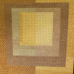 Needlepoint of layered gold squares